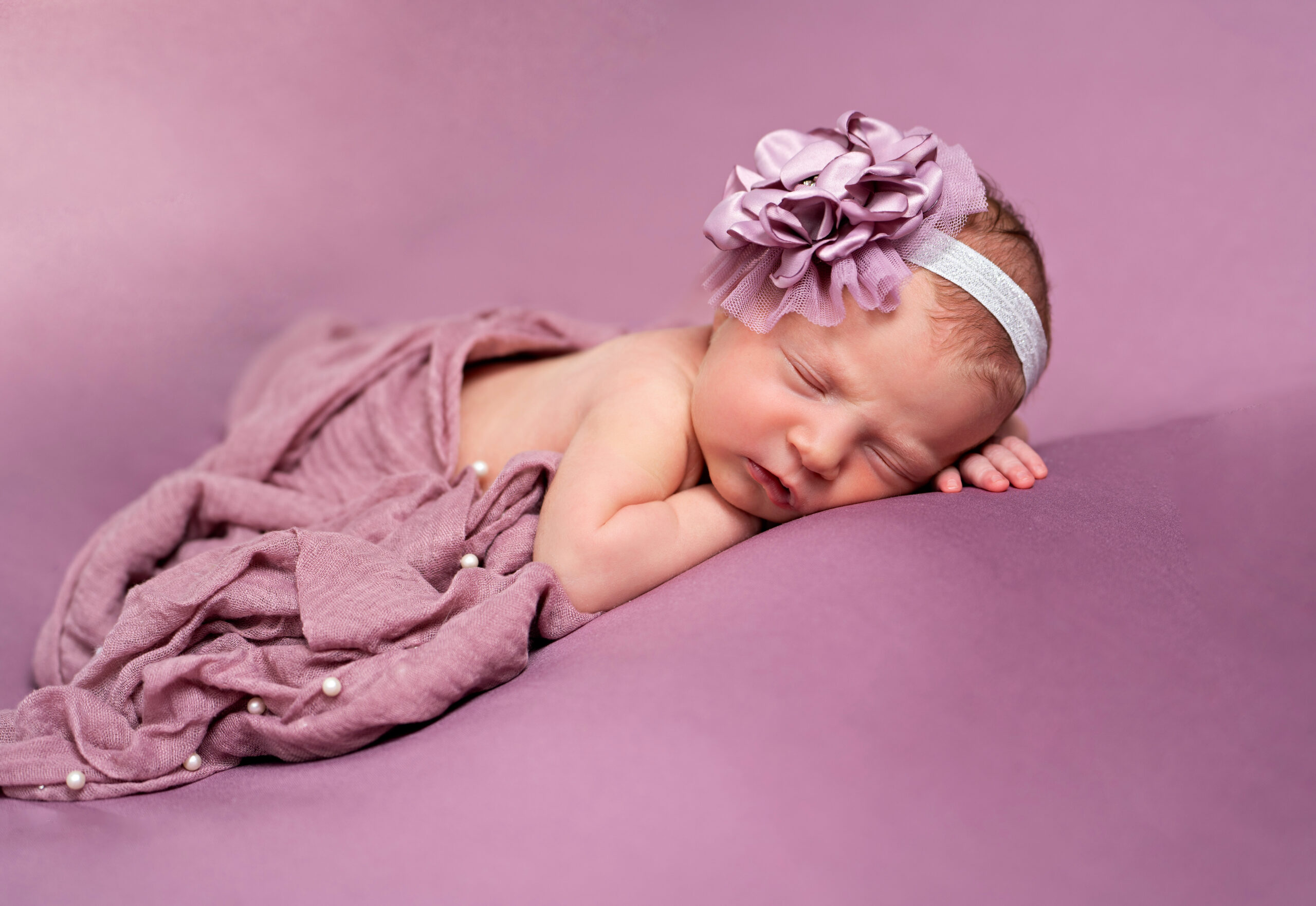 newborn baby girl posed